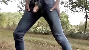 Pissing in jeans and rubber