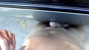 Cumming on summit of a motor car