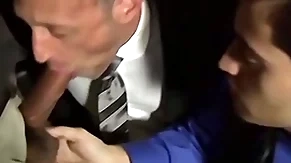Bald bearded stud sucking several cocks in an orgy