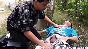 Asian doctor blows twink outdoor painless first aid